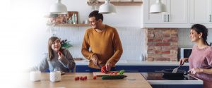 Family happily making dinner