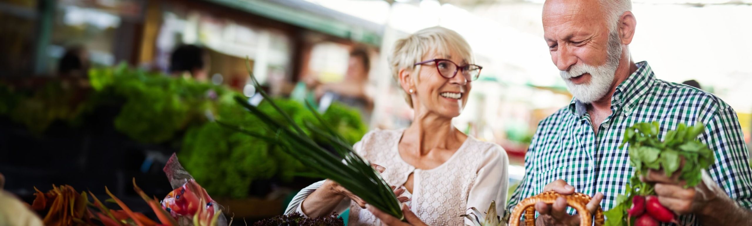 Older Woman and Man Shopping for Groceries